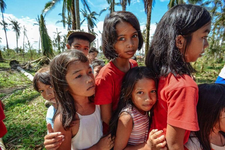 Children queues for the relief goods